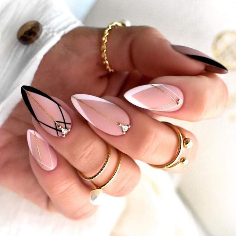 Acrylic Nail Service pink nails with jewels and white and black tips. Hastings nails.